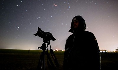 Man looking at starry sky by Telescope (Image Credit unsplash)